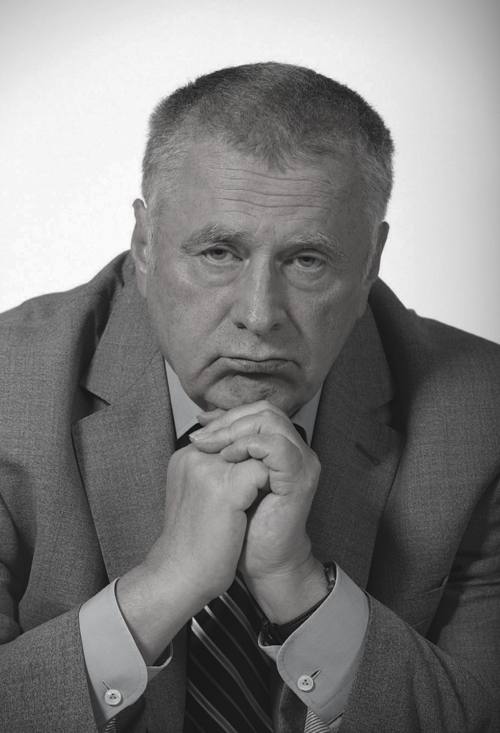 Портрет Владимира Жириновского в деловом костюме на трибуне